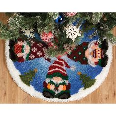 a christmas tree skirt with snowmen on it