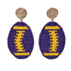 Your game day ensemble will be complete when you put on these LSU Tigers Touchback earrings. They feature a team color football and bold LSU Tigers graphics. The post-back closure ensures comfortable wearing all day long. Hoop measures approx. 1.25" in width; 2.25" in length Imported Post back closure Disk measures approx. 0.5" Wipe clean with a damp cloth Material: 100% Stainless Steel Officially licensed Brand: Emerson Street Debossed graphics Hand beaded graphics with felt backing Football Tshirt Designs, Football Helmet Design, Football Earrings, Gold Bead Earrings, Clear Purses, Lsu Tigers, Hand Beading, Purple Gold, Gold Beads