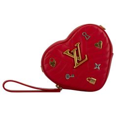 Louis Vuitton limited edition heart shape red leather bag with logo silver and gold charms. Can we born as a clutch, waist bag or cross body bag. Shoulder strap 20". Comes with dust cover and box. (box corner slightly damaged). Luxury Bags For Valentine's Day, Luxury Crossbody Bags For Valentine's Day, Luxury Leather Heart-shaped Bag, Luxury Heart-shaped Shoulder Bag For Gift, Luxury Heart-shaped Leather Bag, Luxury Heart-shaped Shoulder Bag As Gift, Luxury Heart-shaped Bags For Gifts, Designer Shoulder Bag For Valentine's Day, Luxury Heart-shaped Shoulder Bag