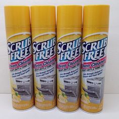 four yellow spray cans with the words scrub free on them