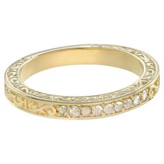 This is a lovely Victorian era design band ring in 14k yellow gold. It is set with nine rose cut diamond, estimated total weight is .14 carat H color, SI clarity overall. Beautifully made yellow gold band with engraved design. Ring Information Style: Victorian Metal: 14K Yellow gold Total weight: 4.60 g. (approx. total weight) Gemstones Type: Diamond Shape: Rose Cut Round Shape Average Color: H Average Clarity: SI Size: 1.5 mm. Number: 9 Weight: 0.14 Carat (approx.) An attractive ring box is inc Engraved Design, Number 9, Rose Cut Diamond, Diamond Shape, Vintage Diamond, Ring Box, Victorian Era, Vintage Stil, Gold Bands