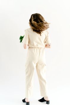 Button-Up Utility Jumpsuit *ONLINE EXCLUSIVE ONLY* DEETS: Collared button-up utility style short sleeve jumpsuit. Side pockets on legs. Elastic waistband. Available in 2 Colors: -Pistachio -Cream (Ivory/Off-white) 60% Cotton. 40% Polyester. Contrast: 100% Rayon Models are wearing size Small. DISCLAIMERS: Please be sure to read our Shop Policies and FAQ pages for full disclaimers. Always keep in mind while we do our best to keep colors as accurate as possible, depending on your computer screen co Fitted Utility Jumpsuit With Button-up Design, Utility Denim Button-up Jumpsuit, Button-up Jumpsuit With Pockets In Medium Wash, Medium Wash Relaxed Fit Button-up Jumpsuit, Fitted Button-up Utility Jumpsuit/romper, Short Sleeve Jumpsuit, Utility Jumpsuit, Pistachio Cream, Utility Style