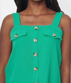 This beautiful top is the perfect addition to your wardrobe for any occasion. The kelly green color will make you stand out in a crowd and the straight neckline adds elegance to your look. The faux button down and chest pockets add an extra touch of style without compromising comfort. Plus, this sleeveless top is perfect for layering or wearing on its own during warmer weather.Available in sizes S-XL while supplies last. Chic Green Tops With Button Closure, Green Tops With Button Closure For Summer, Green Buttoned Pockets Tops For Workwear, Green Sleeveless Buttoned Tank Top, Green Sleeveless Tops With Pockets, Trendy Green Top With Button Closure, Trendy Green Tops With Button Closure, Trendy Summer Tops With Buttoned Pockets, Green Sleeveless Blouse For Work