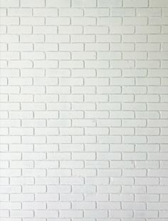 a white brick wall with no mortars on it