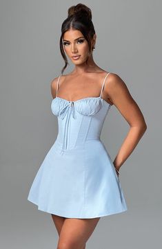 Another pretty mini to add to your collection, the Lacey dress is made in our lightweight, luxe cotton blend fabric. With gathered, underwired cups and tie detail, the waist cinching boned bodice is complemented by a flirty, voluminous skirt. A lace up detail to the back completes the look. 



Colour: Blue.

Premium non-stretch cotton blend.

Fully lined.

Corset design with underwired cups.

Gathered cups.

Boning in bodice.

Delicate tie detail at bust.

Adjustable straps.

Lace up back.

Inv Blue Mini Corset Dress For Summer, Blue Sleeveless Mini Dress With Corset Back, Spring Blue Mini Dress With Corset Back, Bodycon Sundress, Chic Light Blue A-line Mini Dress, Pretty Sundresses, Light Blue Lace Trim Mini Dress, Lace Trim Mini Dress, Streetwear Dresses