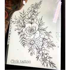 an ink drawing of flowers on a sheet of paper with the word chilk tattoo written below it