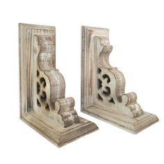 pair of carved wooden bookends with decorative carvings on the sides, whitewashed finish