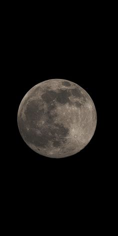 an airplane flying in the sky with a full moon behind it's back end