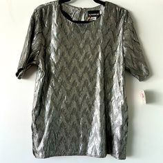 Vintage 80s/90s Deadstock Short Sleeve Silver Blouse By Notations. Size Medium. Original Tags Attached. 16” Shoulder To Shoulder 20” Armpit To Armpit. 26” Top To Bottom. Retro Tops For Spring Night Out, Retro Tops For Night Out In Spring, Vintage Short Sleeve Tops For Party, Vintage Summer Blouse For Night Out, Retro Spring Formal Tops, Retro Formal Spring Tops, Spring Retro Formal Tops, Silver Blouse, Petite Blouses