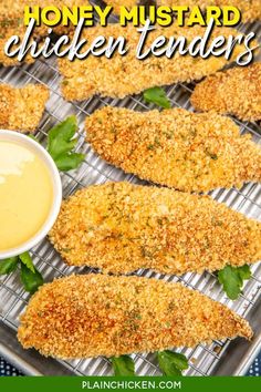 honey mustard chicken tenders on a cooling rack with dipping sauce