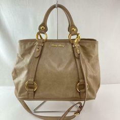 Auth Miu miu Handbag 2way Shoulder Bag Beige Leather Italy Description Condition: B (Good condition but signs of small scratches and / or stains) Color Beige Size (approx): W 42cm H 24cm D 11cm Size (approx): W 16.54inch H 9.45inch D 4.34inch Condition: B  N : (New)  S : (Almost brand new)  A : (Great condition Light signs of use with tiny scratches and/or stains)   B : (Good condition but signs of small scratches and/or stains)  C : (Noticeable signs of use with scratches and/or stains) Payment Miu Miu Handbags, America And Canada, Stain Colors, Michael Kors Jet Set, Middle East, Miu Miu, Favorite Things, Bags Handbags, Shoe Accessories