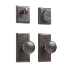 three metal knobs and one door handle on a white background with the same design