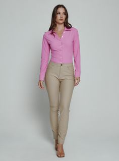 The Luxe Blouse features 4-Way Stretch fabrication that is both moisture-wicking and wrinkle free. This is a flattering semi-fitted blouse designed with mother of pearl buttons for a sophisticated look. Perfect for the office or a fancy dinner on the weekend. Details Model is 5'10" and wears a size small. Care: Machine wash cold on delicate cycle with similar colors. Do not bleach. Dry flat. Do not dry clean. Cold hand wash for best results. Composition: 78% Nylon | 22% Spandex Stretch Button-up Blouse For Business Casual, Business Casual Stretch Button-up Blouse, Fitted Long Sleeve Professional Blouse, Professional Long Sleeve Fitted Blouse, Stretch Office Shirt, Slim Fit Elastane Tops For Work, Stretch Blouse With Button Closure For Office, Office Blouse With Button Closure And Stretch Fit, Elegant Stretch Button-up Blouse