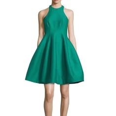 This Stunning Halter Dress From Halston Heritage Is A Must-Have For Any Fashion-Forward Woman. The Colorful Sleeveless Design Is Perfect For Parties And Cocktails, And The Zip Closure Adds A Touch Of Sophistication. Made From A Luxurious Blend Of Silk And Cotton, This Short Dress Is Both Comfortable And Elegant. The Fit And Flare Style Flatters All Body Types, While The Green Color Adds A Pop Of Freshness To Any Outfit. Dry Clean Only To Keep This Dress In Top Condition. Back Zip Topstitched Seams And Tulip Style Skirt Stock Photos Used Length: 37” Pit To Pit: 16” Waist: 15” Excellent Pre- Loved Condition (Rck2) Flare Cocktail Dress, Fit And Flare Cocktail Dress, Halston Heritage Dress, Halston Heritage, Style Skirt, Size 6 Dress, Cotton Silk, Short Dress, Fit & Flare