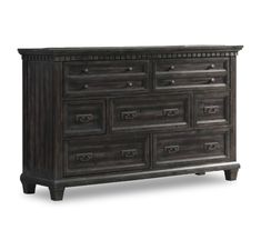 an antique dresser with drawers and knobs on the bottom, in dark brown wood