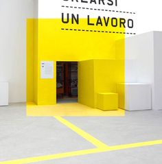 a yellow and white building with a sign on the wall that says, breakfast un lavoro