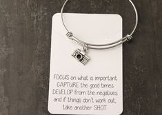 This necklace is adorable! It features a tiny silver plated alloy camera charm on a stainless steel chain, and will come on the attached quote card! Keychain Camera, Camera Earrings, Camera Charm, Qoutes About Camera Photography, Camera Quotes, Camera Necklace, Hand Stamped Ring, Necklace Quotes, Mom Ring