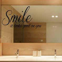 a bathroom mirror with the words smile it takes good on you