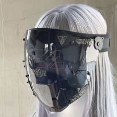 a white wig wearing a futuristic helmet with glasses on it's head and silver hair