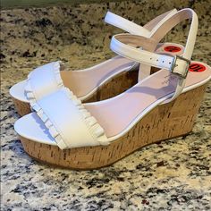 Kate Spade Ruffled Cork Wedge Shoes With White Genuine Leather Upper, Cork Sole, And Rubber Bottoms - New Without Tags - Rear Heel Height Is Roughly 3.8” #185-6o Kate Spade White Open Toe Heels, Chic White Kate Spade Heels, Kate Spade White Sandals With Round Toe, Kate Spade White Round Toe Sandals, Kate Spade White Round Toe Heels, Kate Spade White Summer Heels, Kate Spade White Heels For Spring, Chic Kate Spade Wedge Sandals With Round Toe, Kate Spade Spring Platform Heels