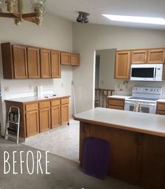 an empty kitchen with white appliances and wood cabinets in the foreground, before and after remodeling