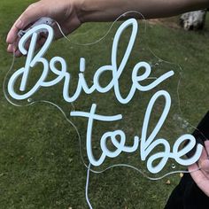 a bride to be sign being held by someone