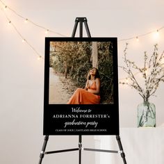 a black and white photo on a easel next to some lights