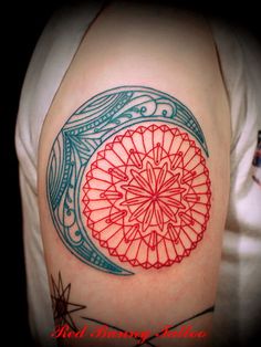 a colorful tattoo on the back of a woman's arm