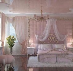 a bedroom with pink walls and white furniture