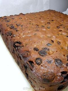 a loaf of chocolate cake sitting on top of a white counter