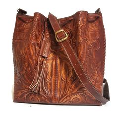 Leather Bag For Women. Featuring a gorgeous chiseled design, this rustic Tooled Leather Purse will help you bring a little vintage flair to your everyday outfit. The perfect size for fitting all of your everyday essentials, this purse was actually handmade with love and care by talented Mexican artisans , giving it a rustic touch that's hard to find in stores.  💮 Measures : height:29 cm.  11.2 inches width : 28cm.  11 inches base:13 cm. 5 inches detachable adjustable large strap: 43inches  110 Brown Embossed Shoulder Bag For Everyday, Leather Shoulder Bag Engraved For Everyday Use, Artisan Engraved Shoulder Bag For Everyday, Artisan Shoulder Bag With Engraved Details For Everyday Use, Artisan Shoulder Bag With Engraving For Everyday Use, Engraved Leather Shoulder Bag For Everyday, Artisan Leather Bag With Engraving, Everyday Leather Shoulder Bag Engraved, Rustic Hand Tooled Bag For Everyday Use