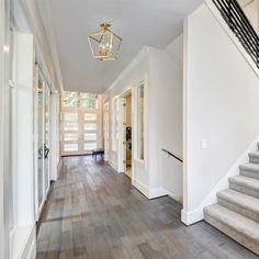 the hallway is clean and ready for us to use as an entrance way in this house