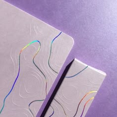 two pieces of paper with colored lines on them