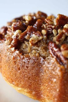 a bundt cake with pecans and raisins on top