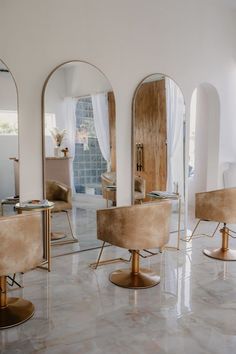 a room with mirrors and chairs in it