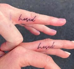 two people with matching tattoos on their fingers that say good and bad written in cursive writing