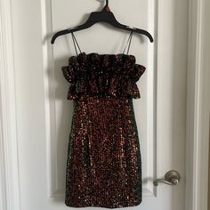 Nwt Never Worn! Black Cocktail Dress With Gold/Bronze Sequins. Measurements Made With Dress Laying Flat: Length From Bust To Bottom Of Dress Is 25.5” Bust 11.5” Across Smallest Part Of Dress Around Waist 10.75” Across Lower Waist (Below Indent) 13.75” Across Hips/Bottom Of Dress Width 15.5” Across Zipper Closure Lined Dress Questions? Leave A Comment Below! Party Strapless Mini Dress With Ruffles, Ruffled Strapless Mini Dress For Party, Sleeveless Ruffled Dress For Holiday Party, Strapless Party Dress With Ruffles, Purple Chiffon Dress, Girls Maxi Dresses, Black Silk Dress, Pink Cocktail Dress, Disney Princess Dresses