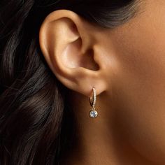 These gorgeous hoop earrings are beautifully crafted from lustrous 14k yellow gold. Shimmering diamonds line the front edge with eye-catching sparkle, and an aquamarine stone hangs elegantly from the bottom of each earring. Diamond Huggies, Diamond Earring, Aquamarine Stone, Blue Nile, Clothing Styles, Bezel Setting, Aquamarine, Diamond Earrings, Hoop Earrings