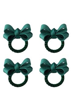 three pieces of green hair with bows on them