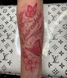 a woman's leg with a tattoo on it and the words underneath her arm