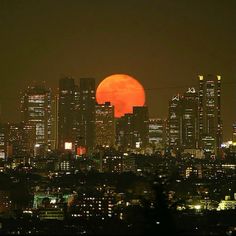 the full moon is seen over a city skyline in this view from san francisco, california