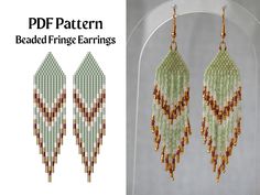 the beaded fringe earrings are made with seed beads