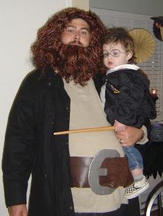 a man and child dressed up in costumes