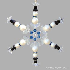 a snowflake made out of glass beads