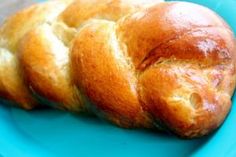 two loaves of bread on a blue plate