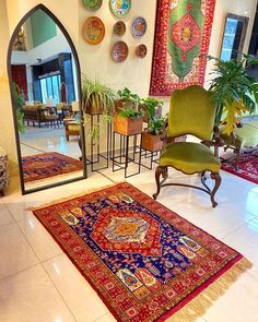 a living room filled with lots of furniture and rugs