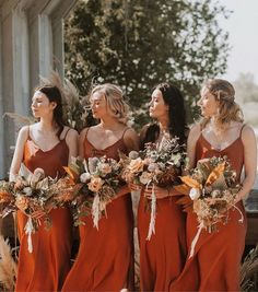 the bridesmaids are all wearing red dresses