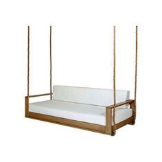 a wooden swing bed with white sheets on it