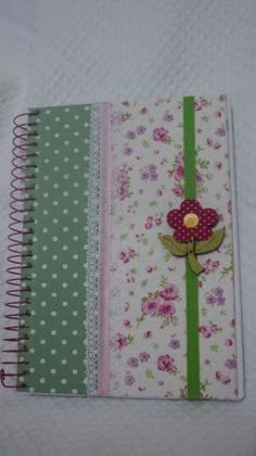 a notebook with flowers and polka dots on it