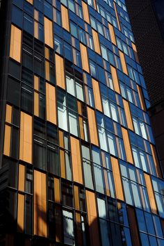 the side of a tall building with many windows